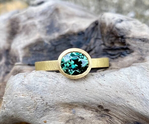 Oval 1.30ct teal sapphire ring