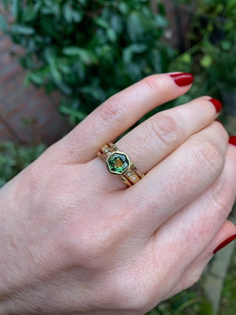 A green sapphire engagement ring