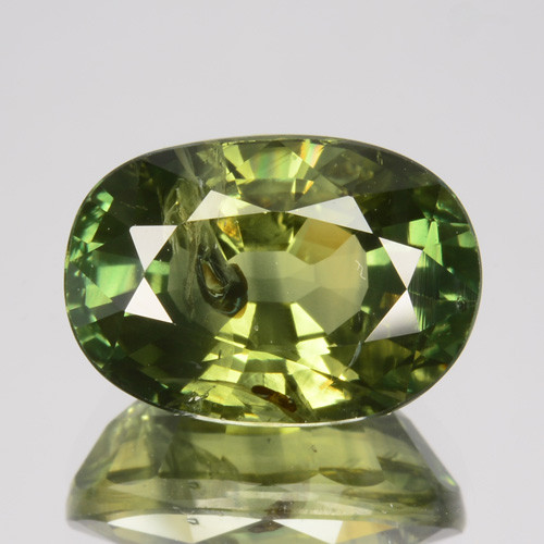 An oval cut green sapphire
